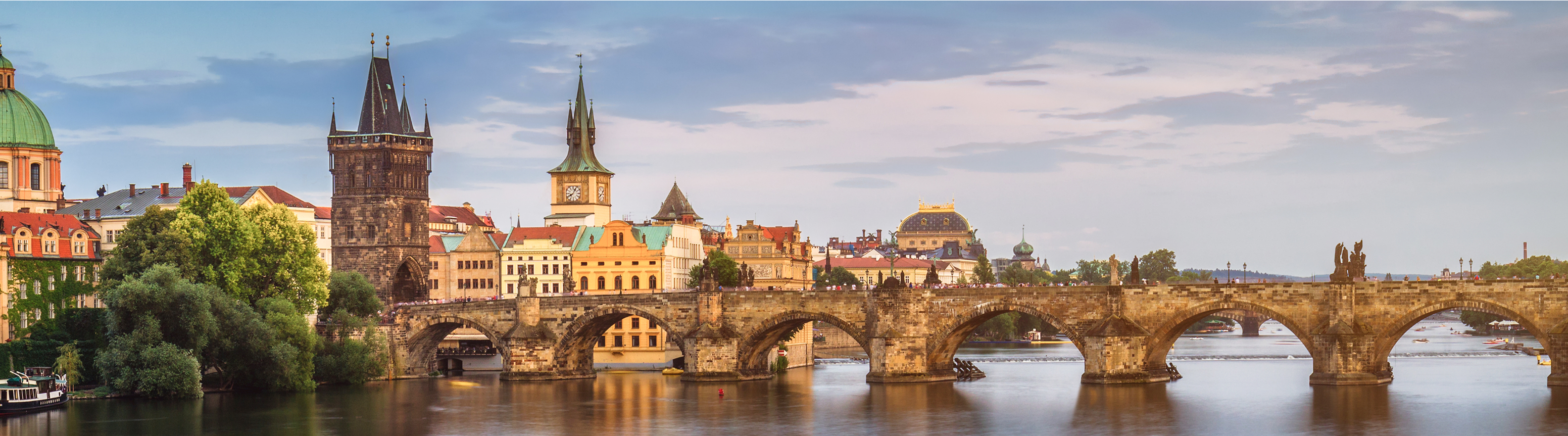 City skyline of Prague with a bridge in the foreground