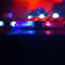 Red and blue lights coming from an emergency vehicle 
