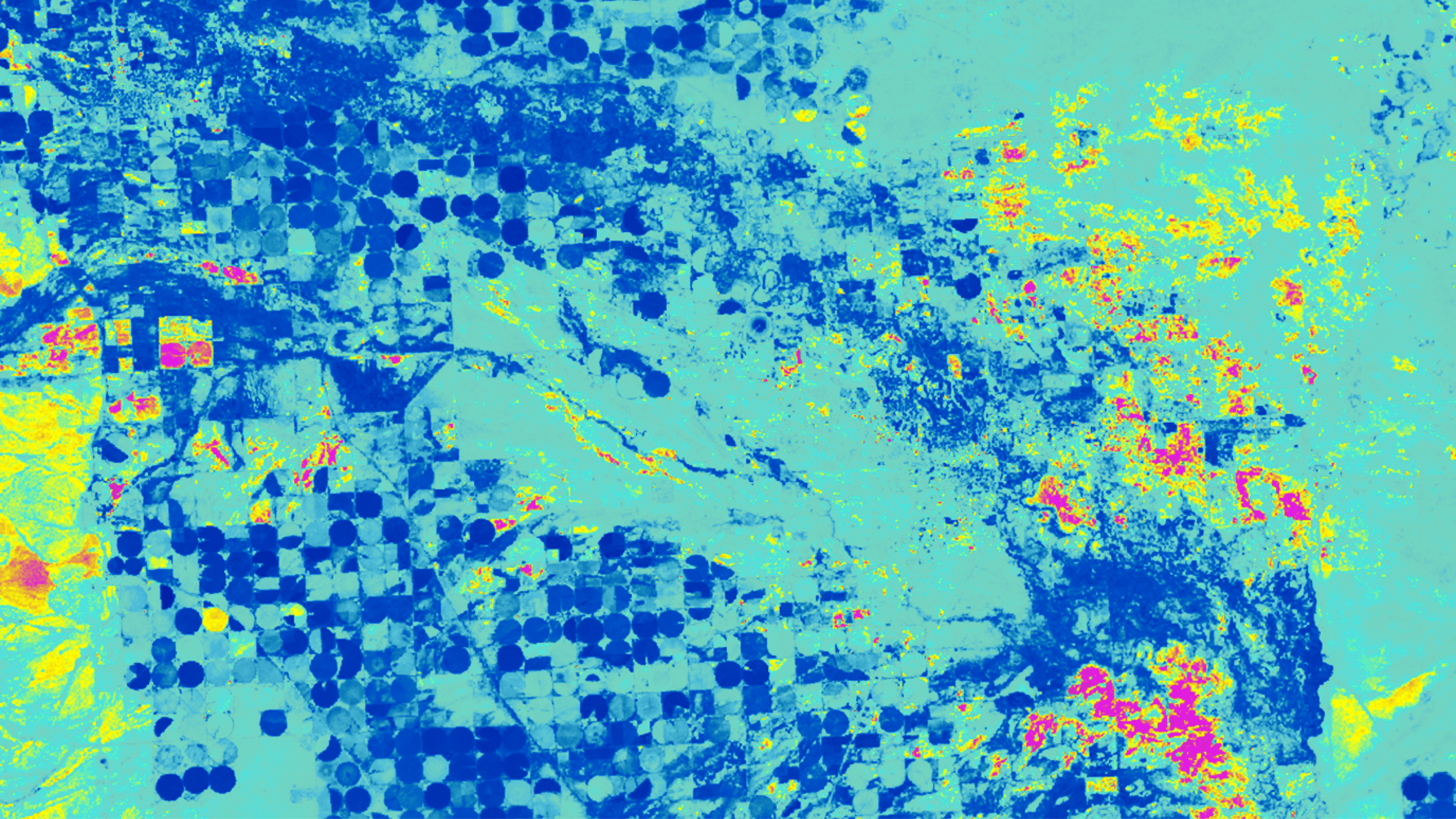 Una mappa multicolore che mostra le condizioni meteorologiche in giallo e rosso su aree coltivate colorate in blu