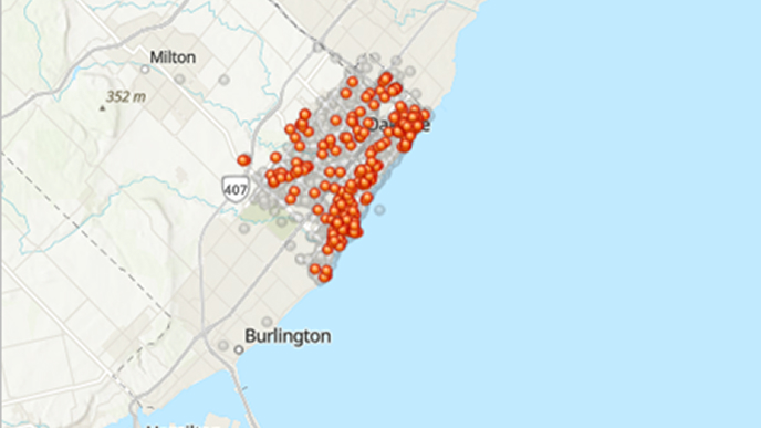 A map of a coastal area with orange dots clustered in one area