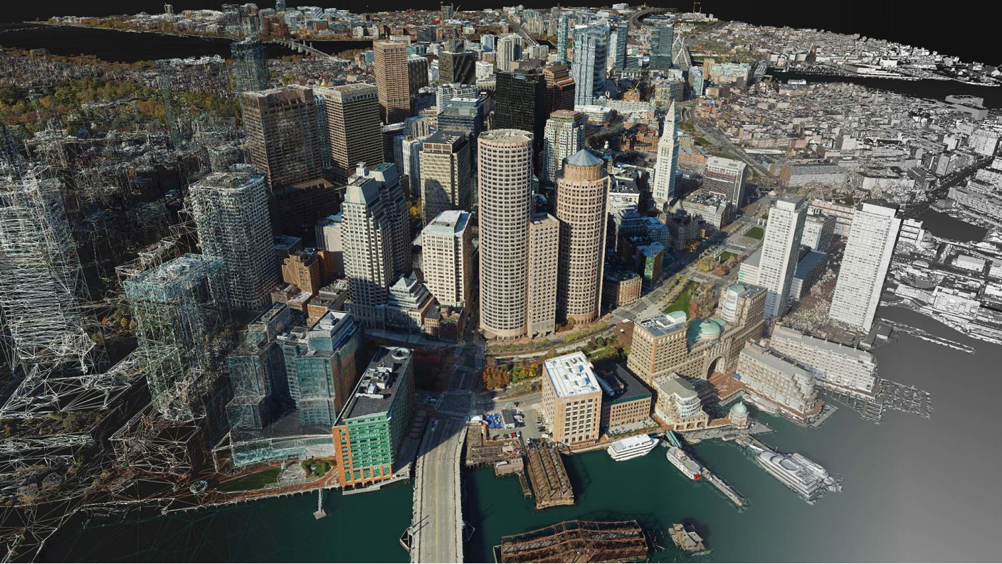 Mesh 3D texturizzate di una città con edifici alti sull'acqua e diversi tipi di formati mesh sovrapposti
