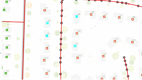 Monitor di computer che mostra strade ed edifici come caratteristiche di linee e poligoni 
