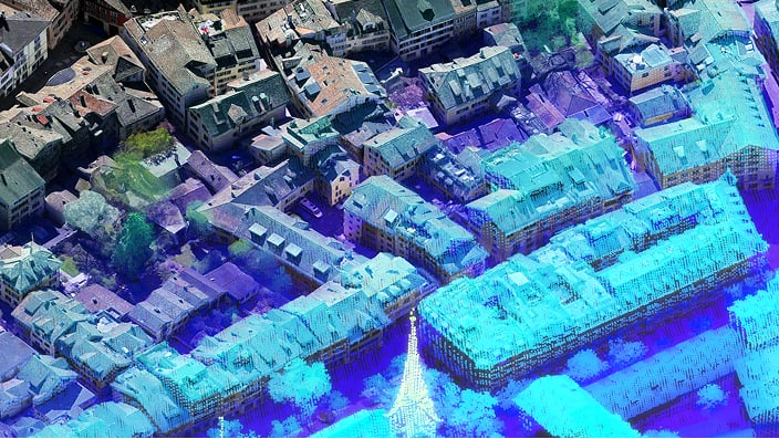 Aerial imagery shows a dense urban neighborhood with tightly packed buildings and narrow streets. 