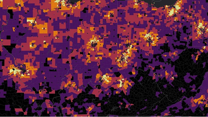The image shows a detailed geographic heatmap composed of colored grid cells over a large region. 