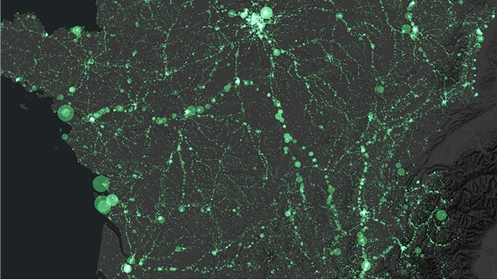 The image shows a dark map overlaid with bright green points and lines representing data across a geographic region. 
