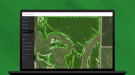 Immagine del monitor di un laptop che mostra una mappa di un terreno agricolo verde accanto alla legenda della mappa su uno sfondo verde