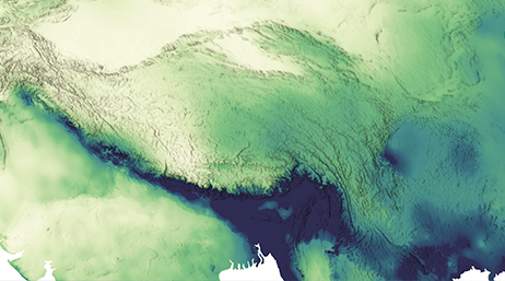 Vista satellitare di terra ombreggiata in tonalità verdi e blu